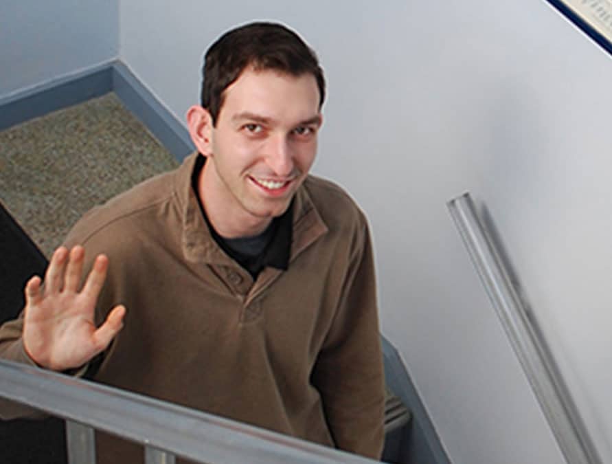 Joseph Clifford, fall communications intern, waves goodbye