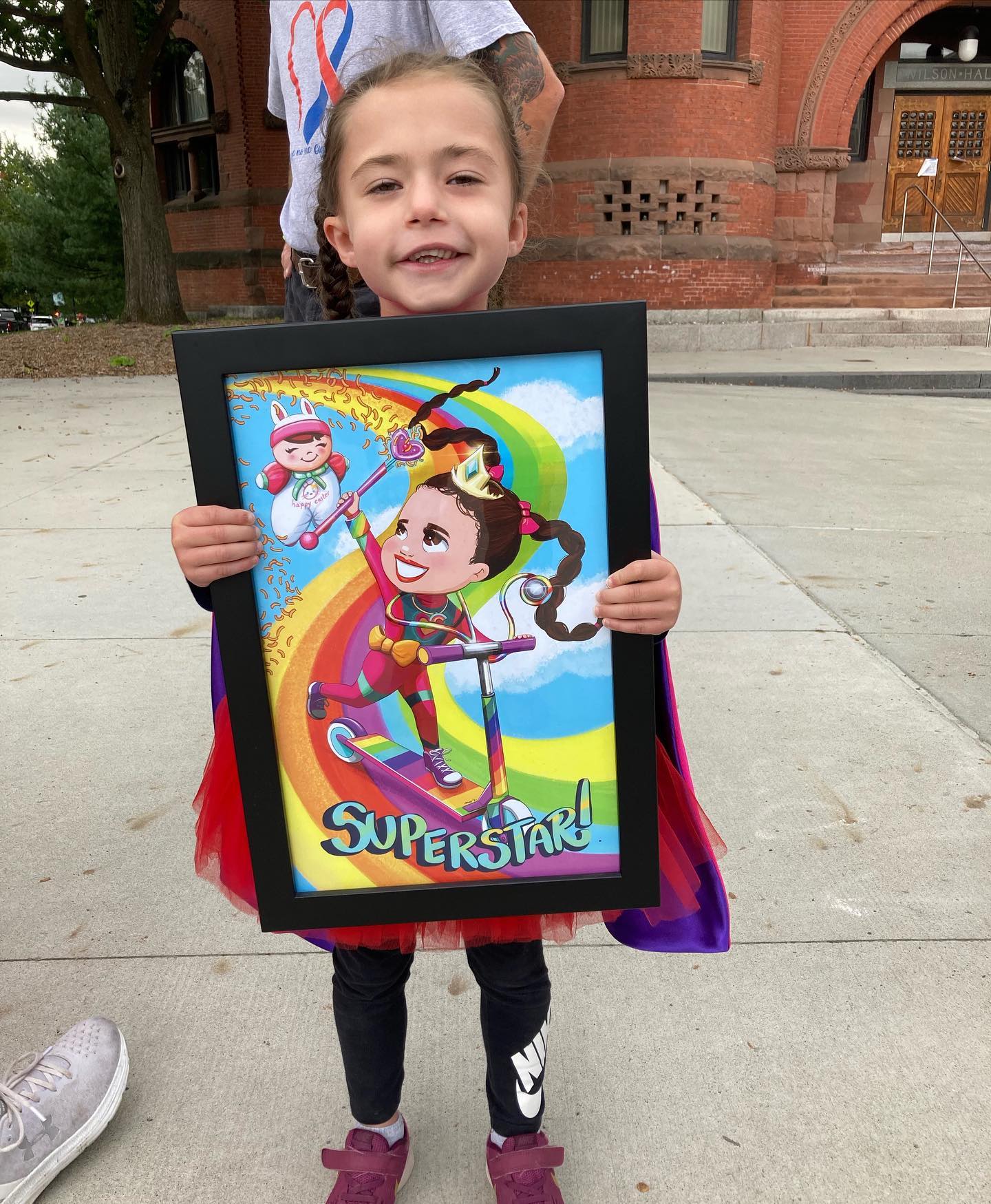 young girl holds up her superhero project illustration