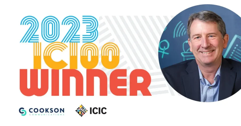 2023 IC100 Winner graphic with a smiling man in a suit and logos for Cookson Communications and ICIC.