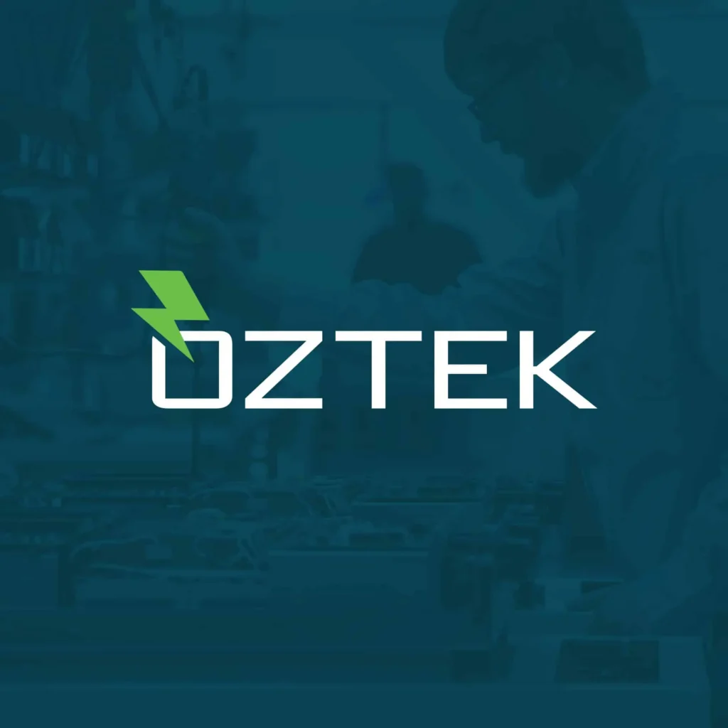 Oztek logo with a green lightning bolt, overlaid on a blue-tinted image of a person working with electronics, showcasing modern manufacturing website design.