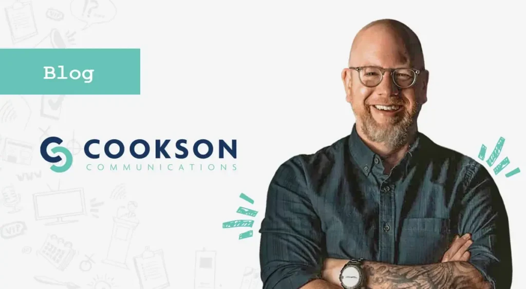 Smiling bald man with glasses and beard stands by Cookson Communications logo and Blog label, ready to discuss WordPress security tips.