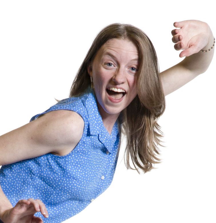 Smiling woman in a blue sleeveless shirt strikes a playful pose against a white background.