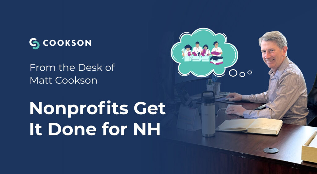 A man at a desk types, thinking about nonprofit teams; text reads Nonprofits Get It Done for NH.